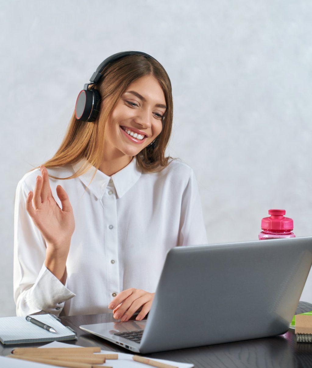 woman-waving-and-talking-during-online-education-on-laptop.jpg
